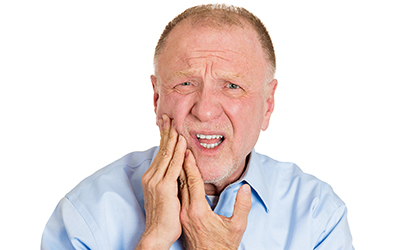 An older man with a toothache