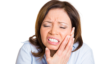 An older woman with tooth pain